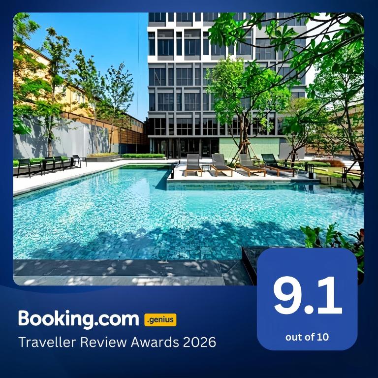 a swimming pool in front of a building at Siamese Residence Sukhumvit 87 Bangkok in Bangkok