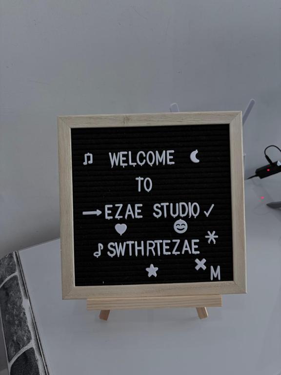 a chalkboard sign with welcome to extreme studio surfknifearma at Ezae Studio D'Perdana Apartment in Kota Bharu