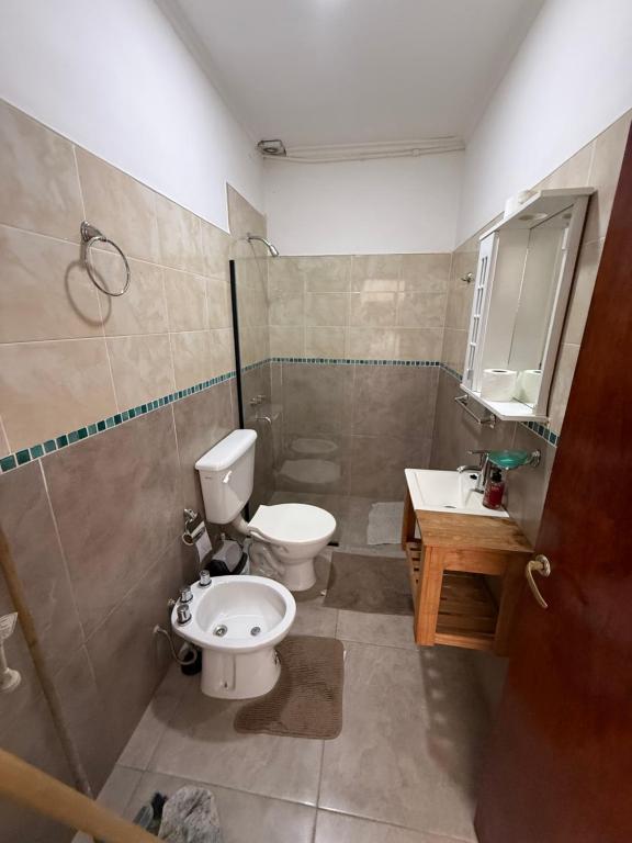 a bathroom with a toilet and a sink at Josefina l in Goya