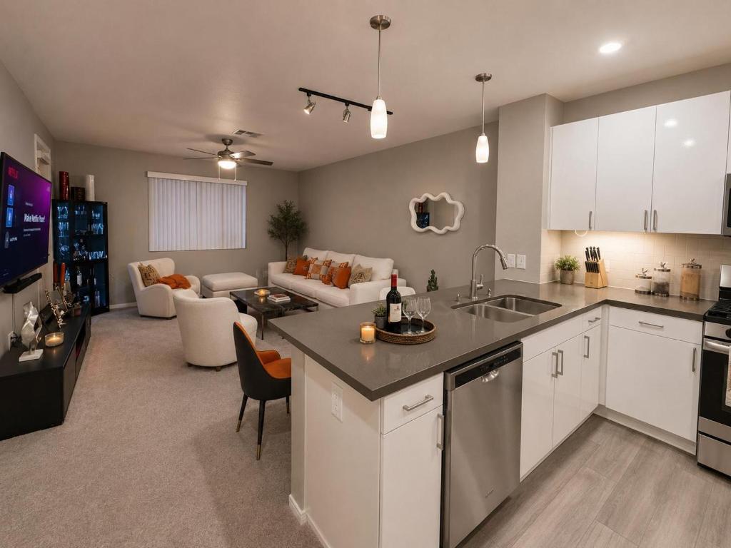 an open kitchen and living room with a couch at Universal Stays Hollywood-Seconds to Universal Studios in Los Angeles