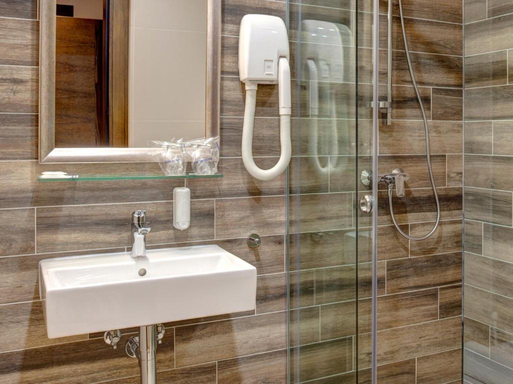 Koupelna v ubytování Garni Hotel Zavicaj