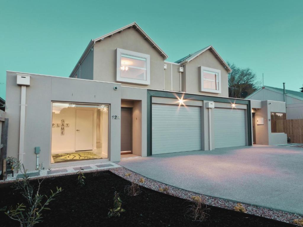 a house with a garage in front of it at Taworri in Queenscliff