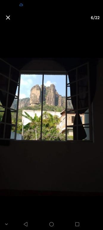 a view of the mountains from a window at Casa Sauces in Tepoztlán