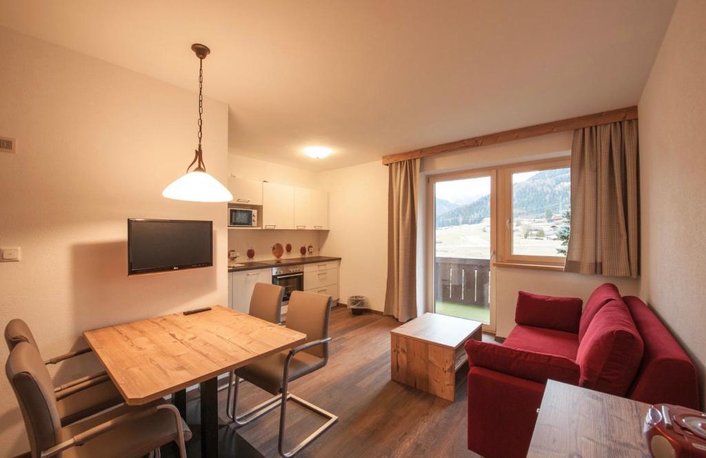 TV a/nebo společenská místnost v ubytování Ferienhaus Larinmos