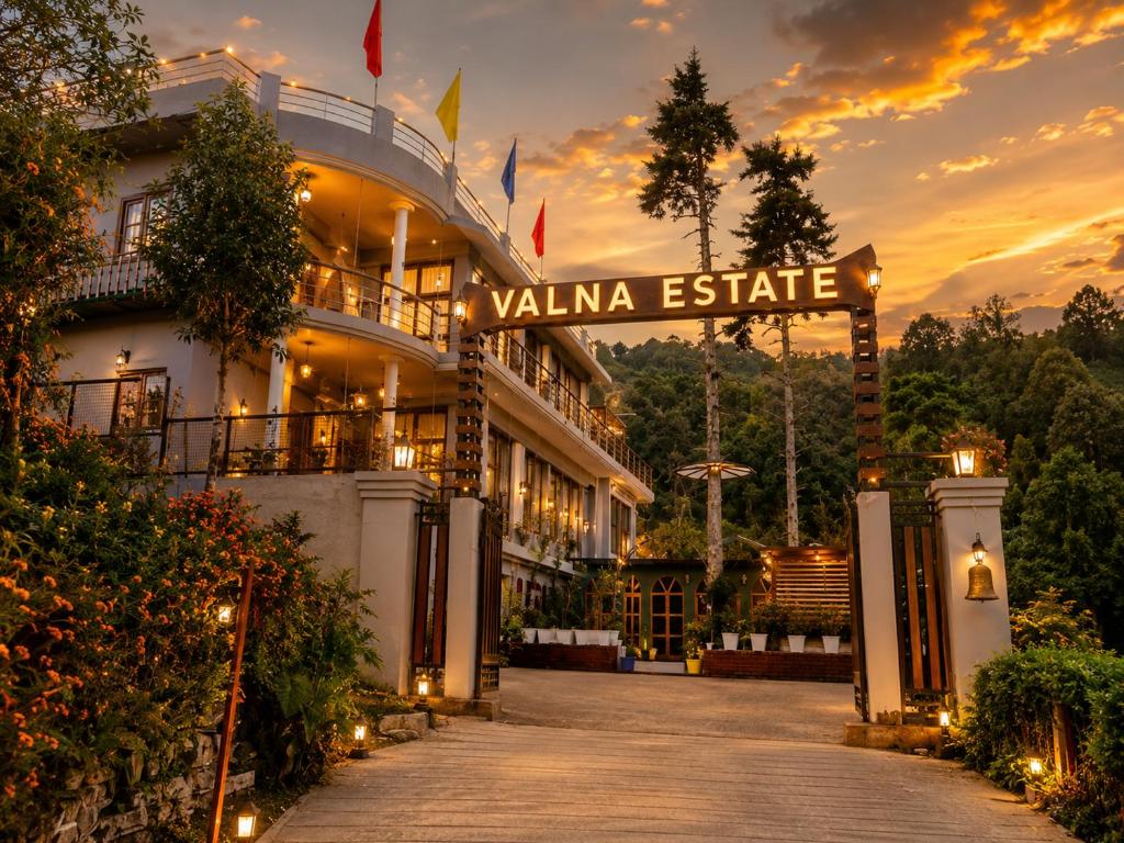 a building with a sign that reads villeiane estate at Hotel Valna Estate Himalyan View Kausani By HRG in Kausani