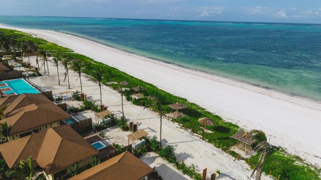 an aerial view of the beach at a resort at ENVI Paje Wellness Lodge in Paje