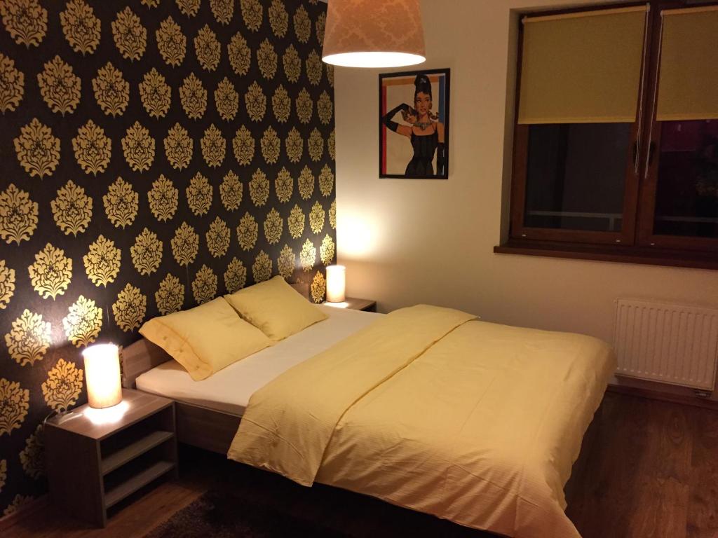 Postel nebo postele na pokoji v ubytování Color Apartment