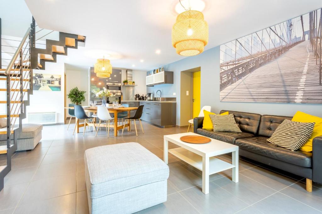 a living room with a couch and a table at La Longère du Salou in Landrévarzec