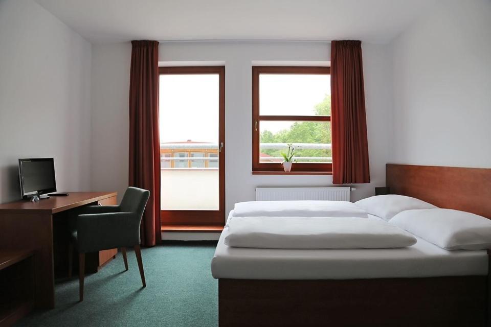 Cama o camas de una habitación en Sporthotel Hostivice