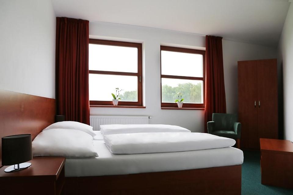 Cama o camas de una habitación en Sporthotel Hostivice