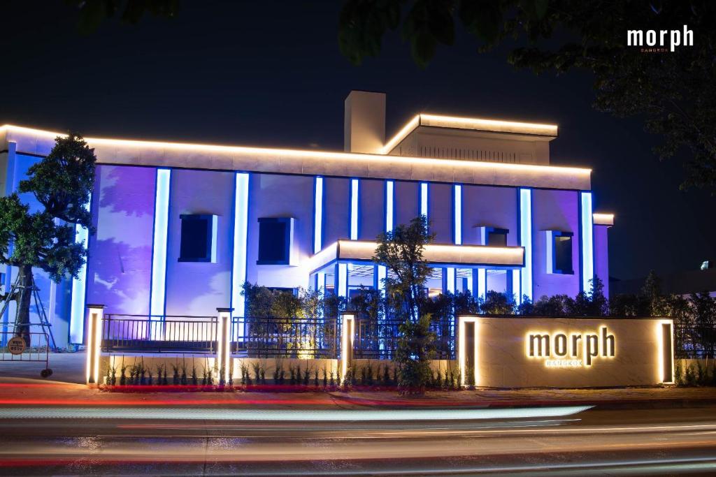 a night view of a large building with lights at morph Bangkok Hotel in Bangkok