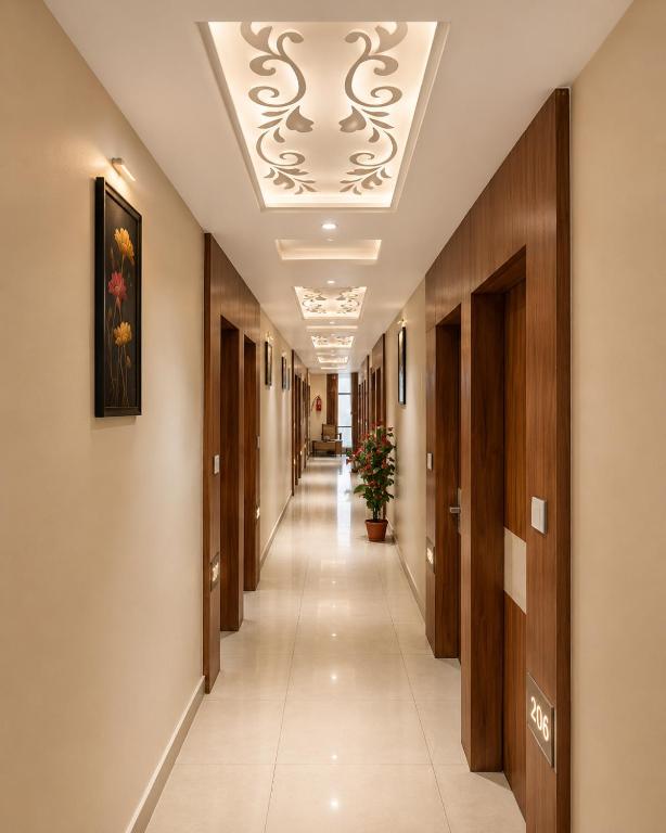 a corridor of a hospital hallway with a ceiling at Hotel Royal Blue in Modāsa