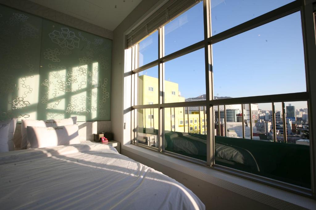 Postel nebo postele na pokoji v ubytování Boutique Hotel Aria Nampo