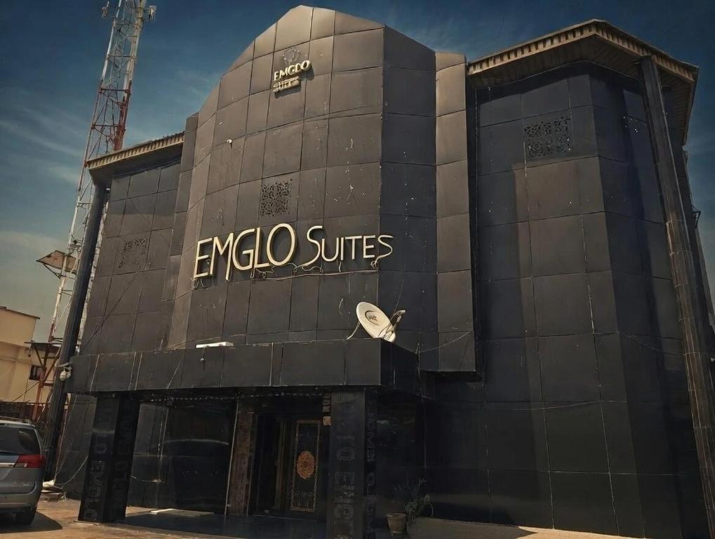 a building with a sign on the side of it at Emglo Suite in Lagos