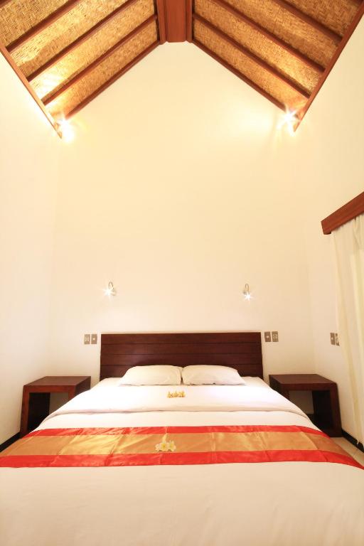 Postel nebo postele na pokoji v ubytování Letos Kubu Homestay