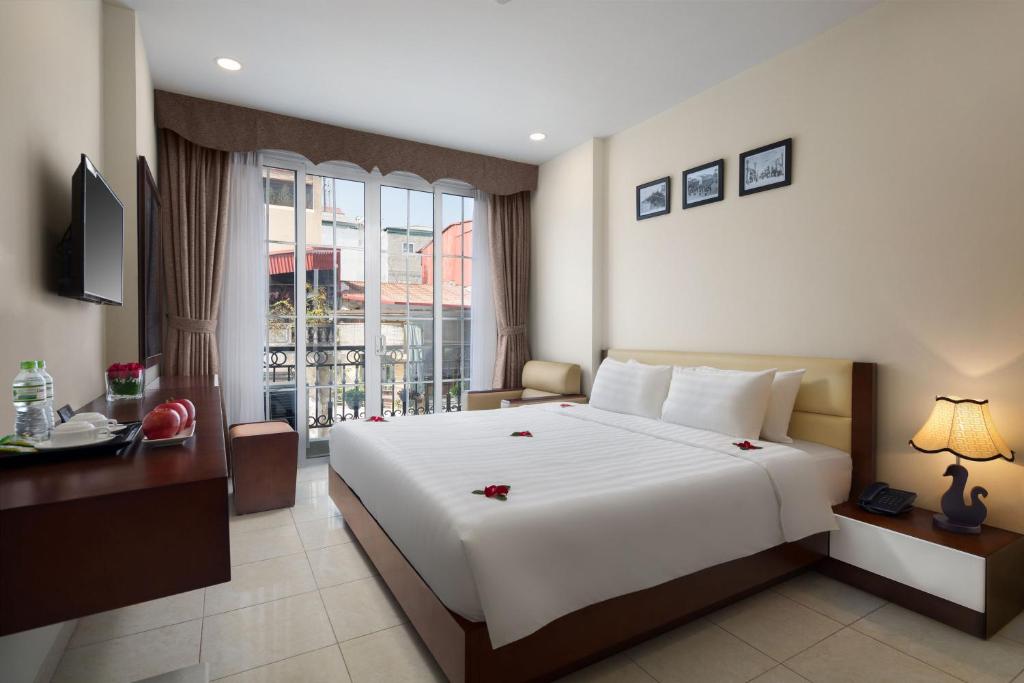 Postel nebo postele na pokoji v ubytování Dream Central Hotel & Spa - Hanoi Old Quarter