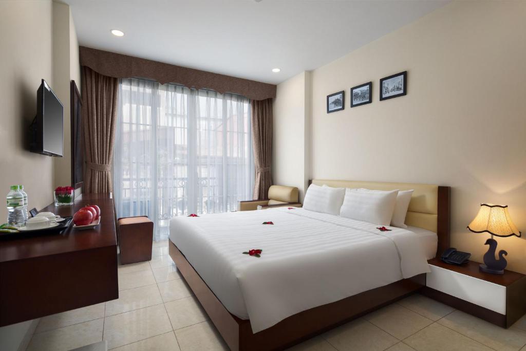 Postel nebo postele na pokoji v ubytování Dream Central Hotel & Spa - Hanoi Old Quarter