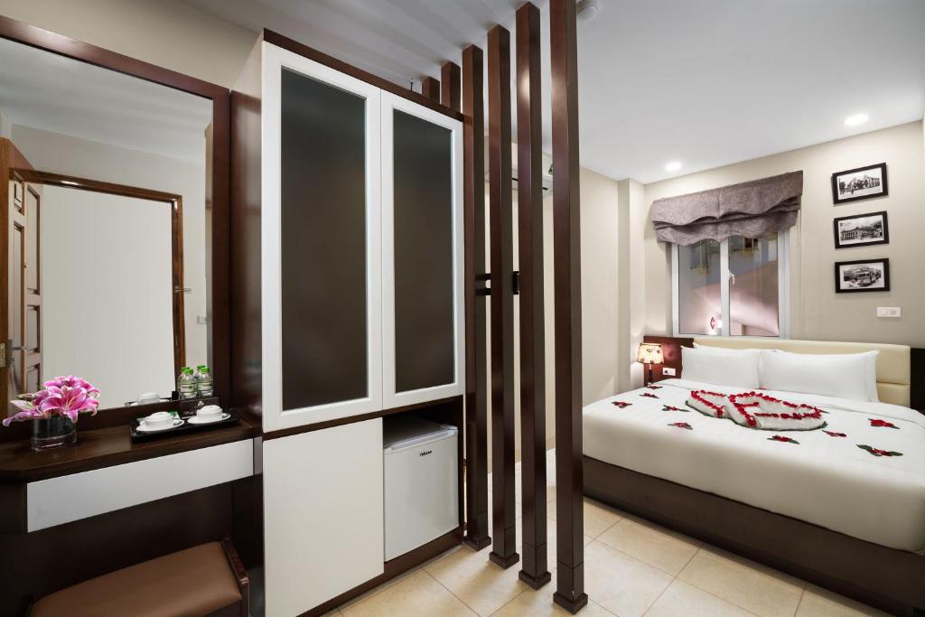 Postel nebo postele na pokoji v ubytování Dream Central Hotel & Spa - Hanoi Old Quarter