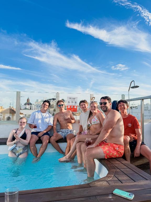 a group of people sitting in the pool on a boat at JOY Plaza de Armas in Seville