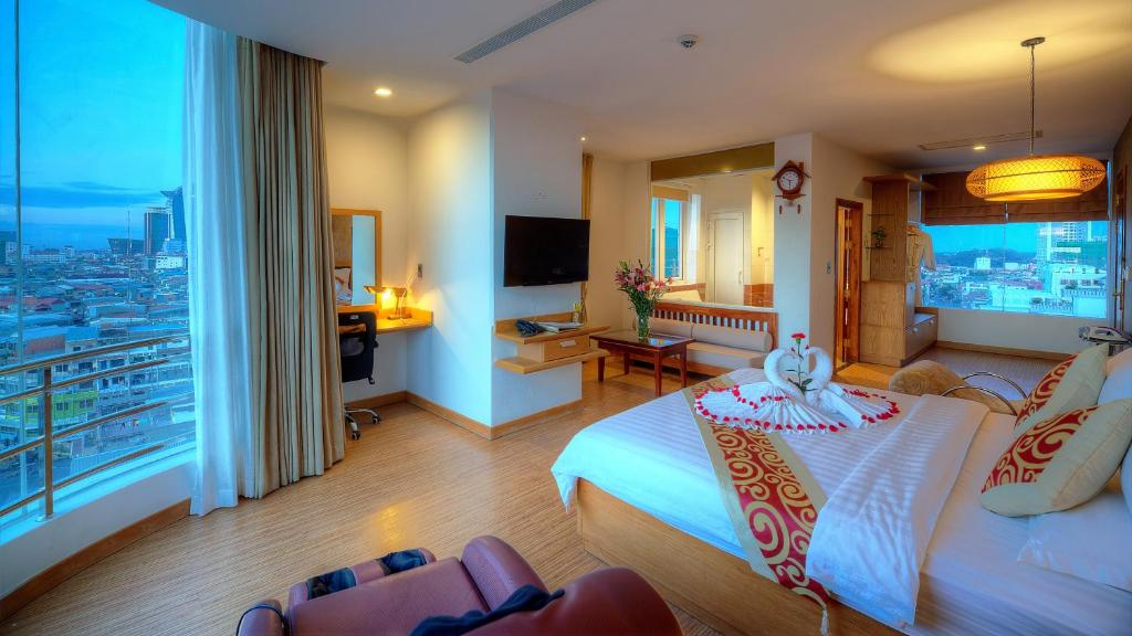 Postel nebo postele na pokoji v ubytování Orussey One Hotel & Apartment