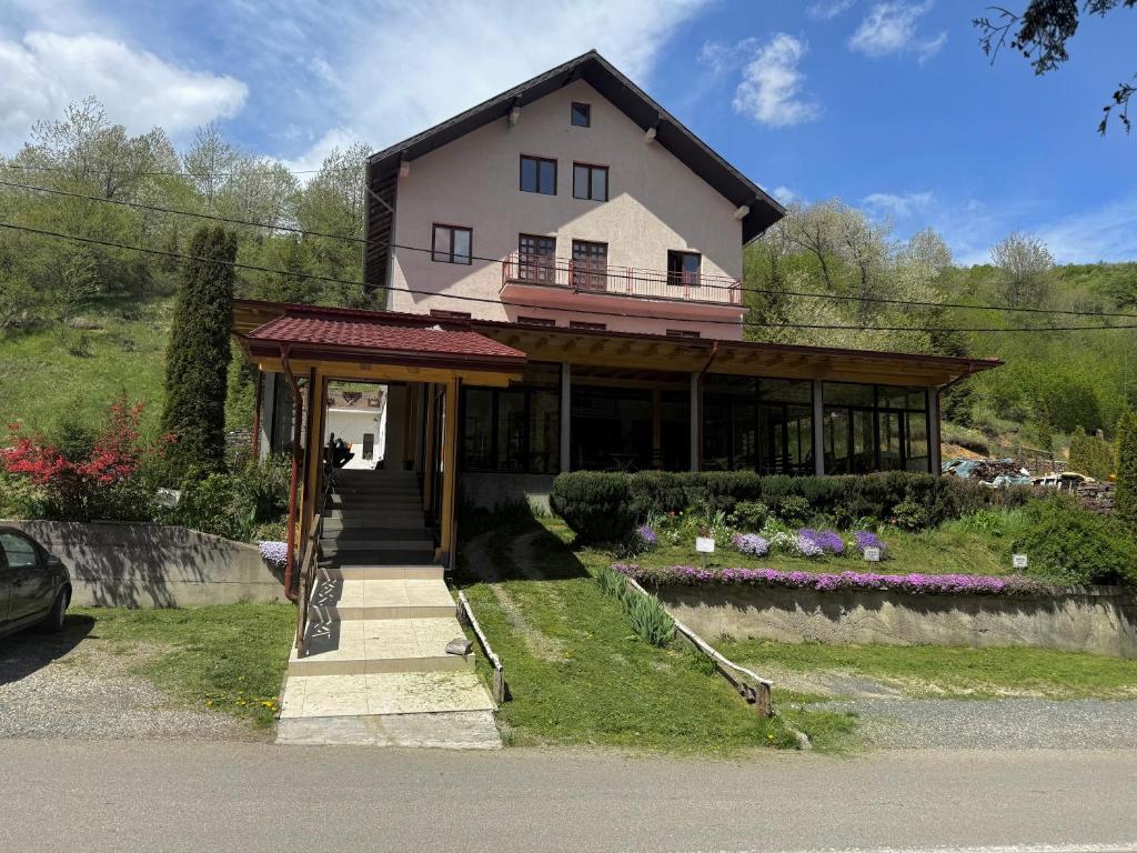 a house on the side of a road at Apartments Vicko in Brzeće