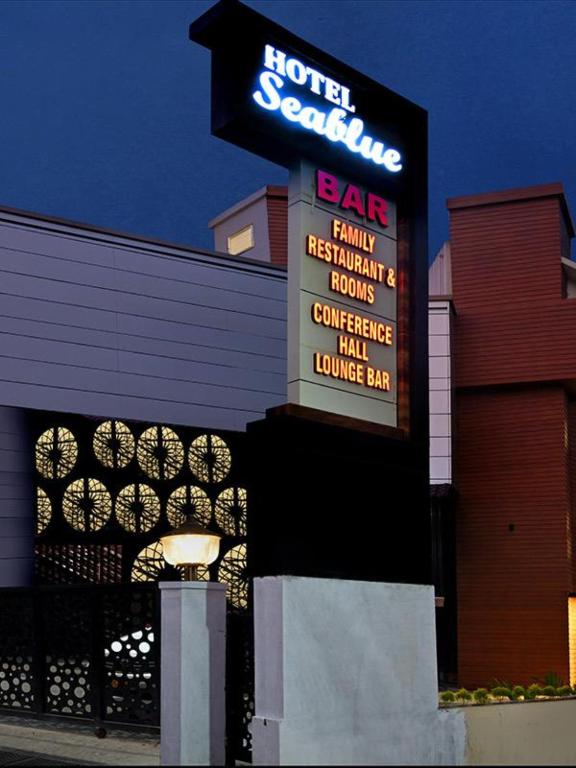 a sign for a hotel satellite bar in front of a building at Hotel Sea Blue MALLAPPALLY in Vennikulam