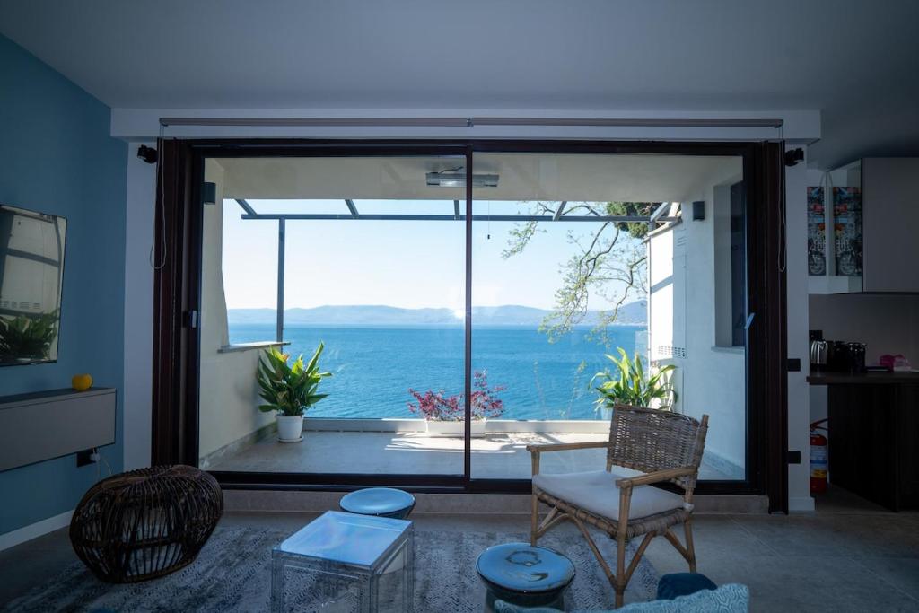 a living room with a view of the ocean at Lagò-Anguillara Sabazia in Anguillara Sabazia