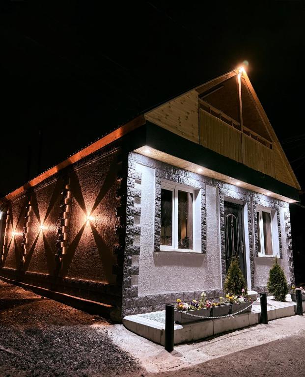 a building with lights on it at night at BelGa Guest House in Gyumri