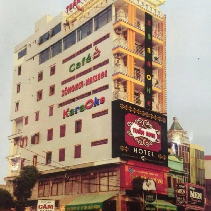 a large building with signs on the side of it at Hotel Tuấn Anh in Vô Hối
