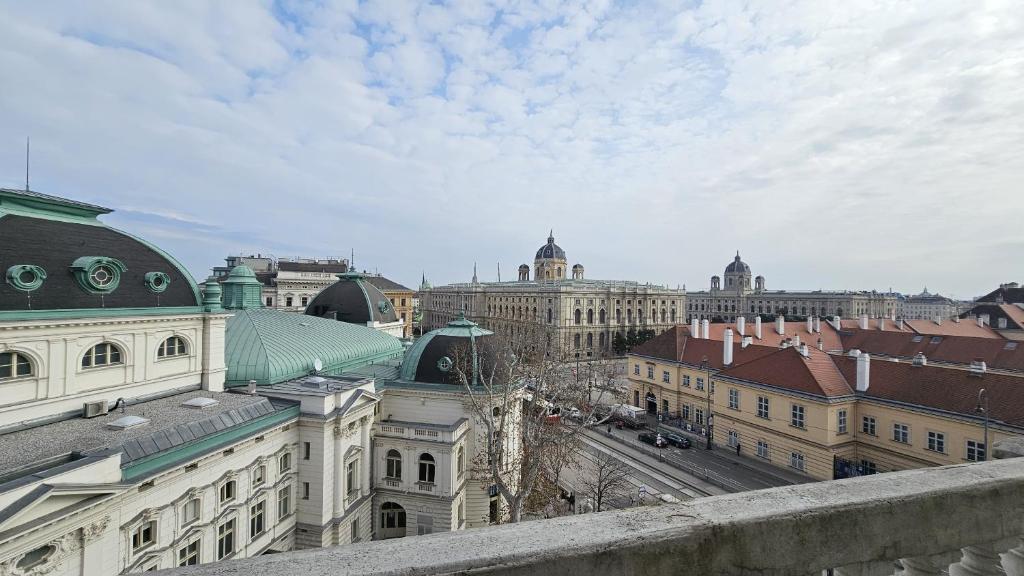 a view of a city with buildings and a street at Hotel Pension Museum in Vienna