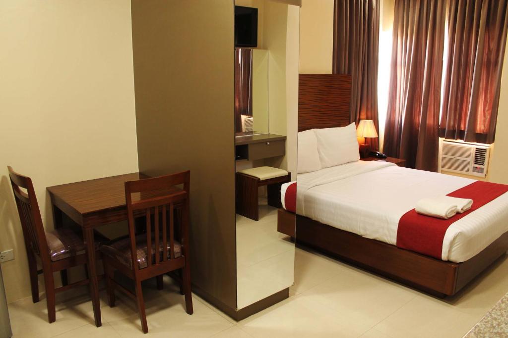 Postel nebo postele na pokoji v ubytování Sebastien Hotel