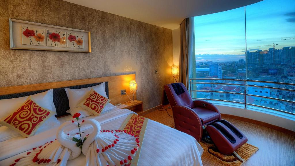 Postel nebo postele na pokoji v ubytování Orussey One Hotel & Apartment