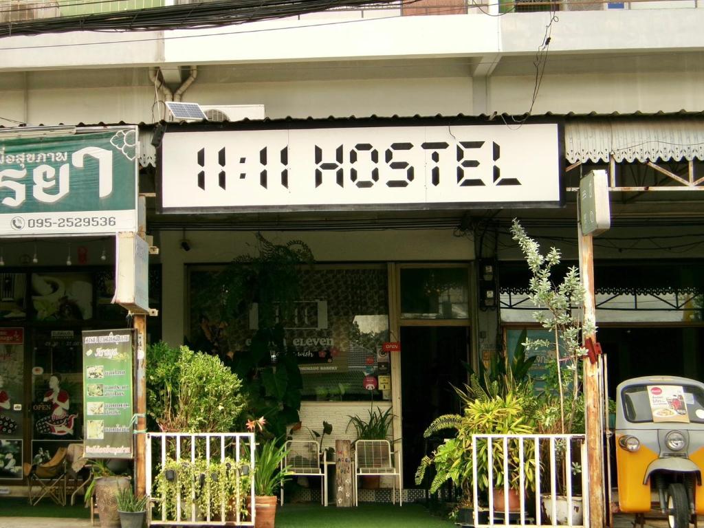 a store with a sign on the front of it at 11:11 Hostel in Phra Nakhon Si Ayutthaya