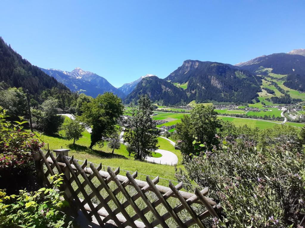 a view of a golf course in the mountains at Mountain chalet in Mayrhofen
