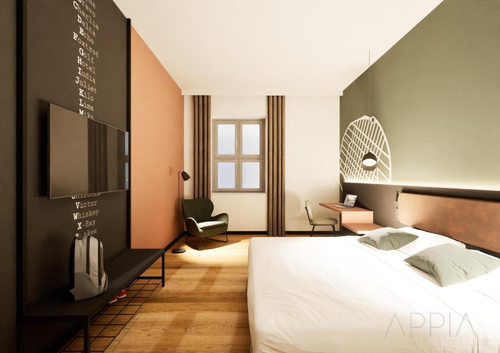 a bedroom with a large bed and a tv at Essential by Dorint Mannheim Taylor Park in Mannheim