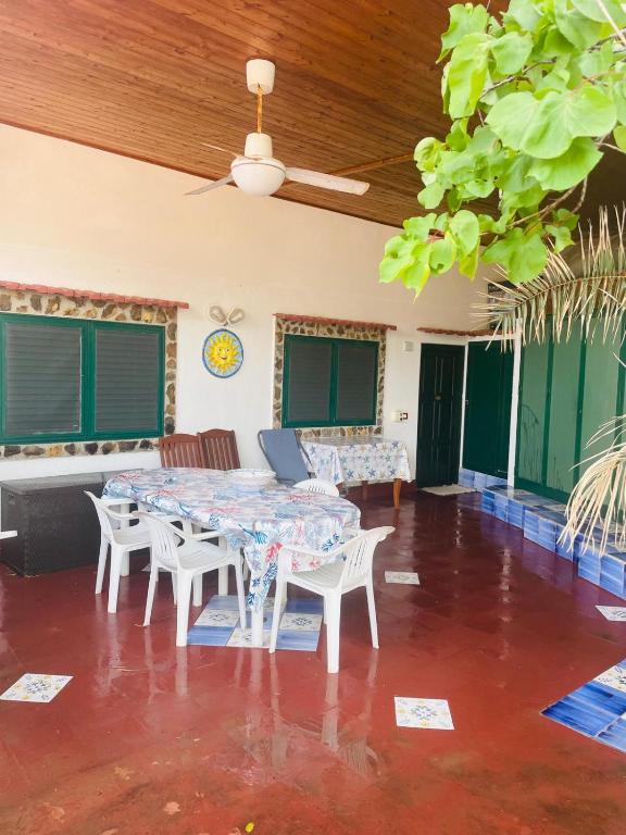 a dining room with a table and chairs at Villa Iovane Diamond in Ustica