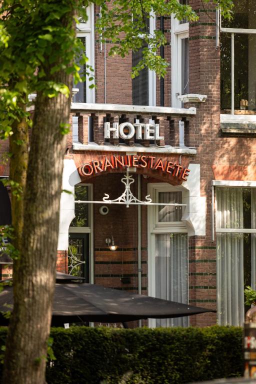 a hotel sign on the side of a building at Oranjestaete Boutique Hotel & Apartments in Nijmegen