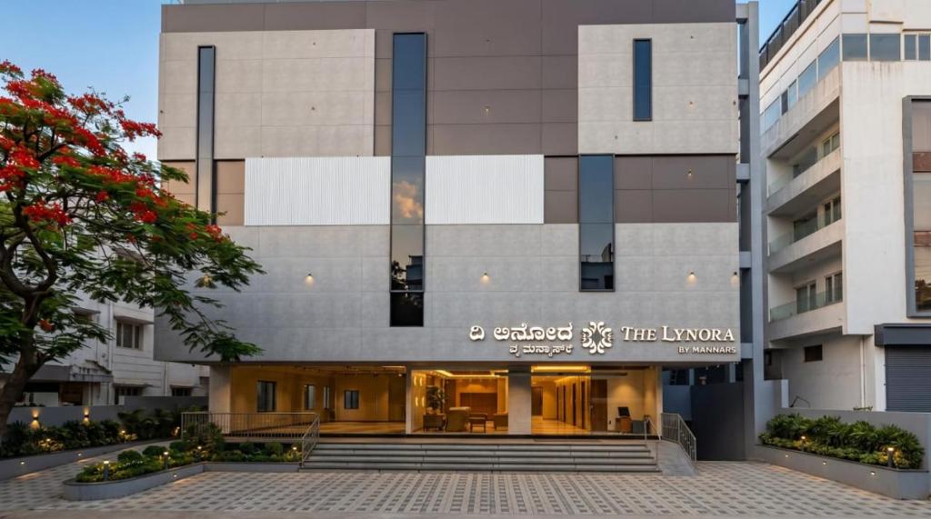 a building with a sign that reads embassy x the liverpool at The Lynora in Mysore