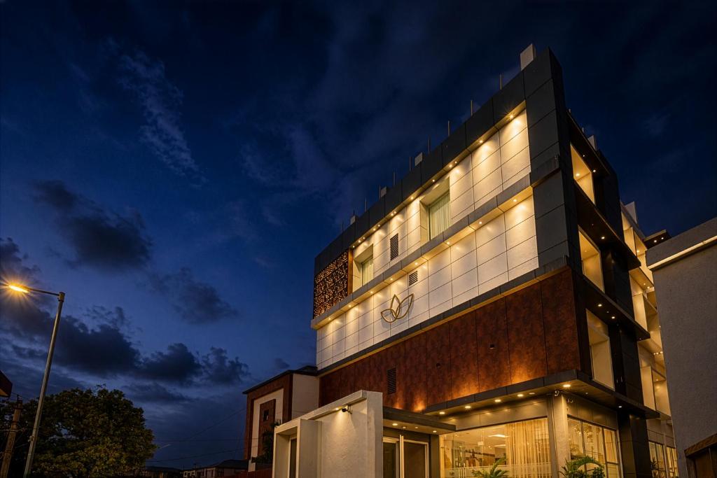 a building with lights on the side of it at Grand Continent Hotel, Rameswaram in Rāmeswaram