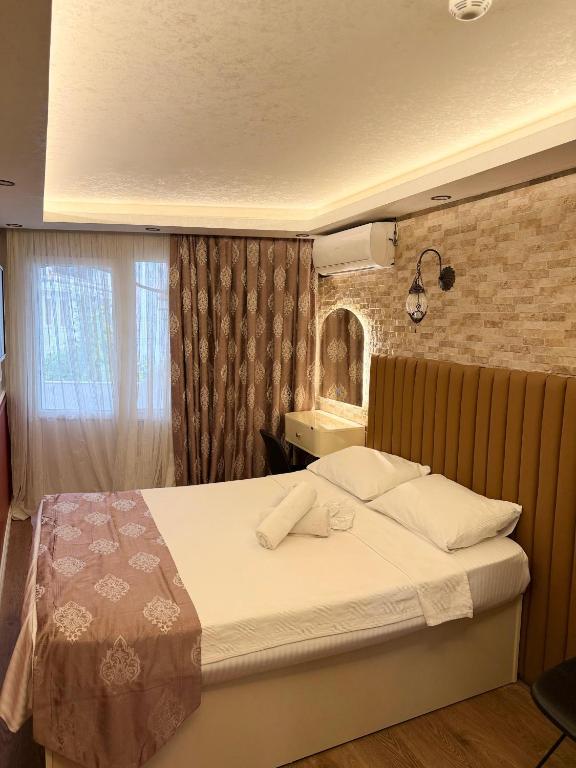 a bedroom with a large bed in a room at elisa apart 3 in Istanbul