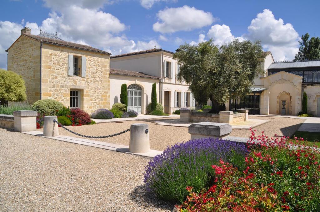 a house with a garden in front of it at Château la Rose Perriere in Lussac