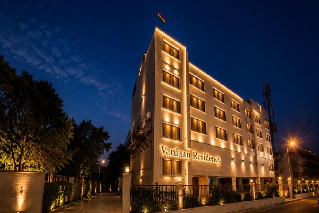 a building with a sign that reads vaughan residence at night at Vardaan Residency Hotel in Gorakhpur