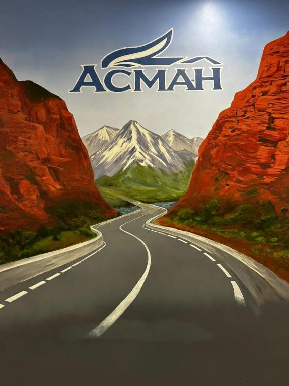 a road in the middle of a mountain at Asmanguesthouse in Naryn