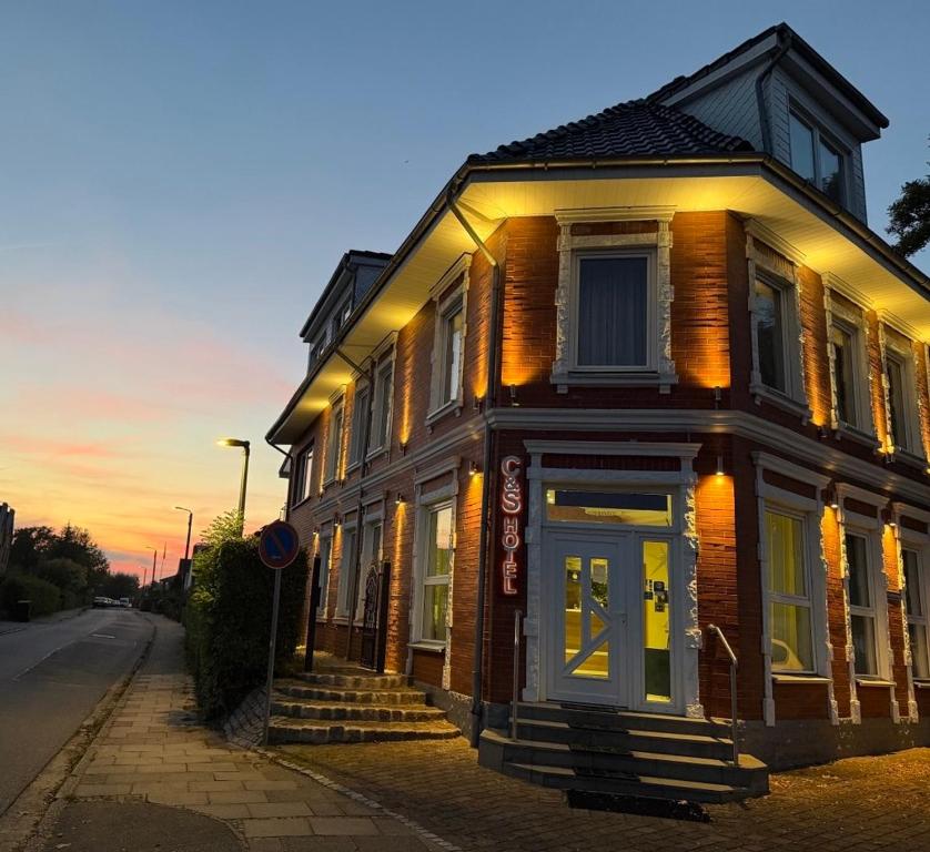 a building on the side of a street at C&S Hotel in Pinneberg