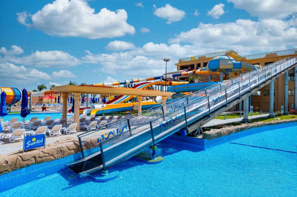 a water slide at a resort with a pool at Stella Beach Resort & Spa Makadi Bay - 24 HRS All Inclusive in Hurghada