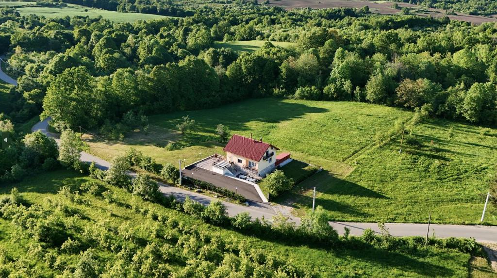 an aerial view of a house in the middle of a field at Monte Symphony in Rakovica