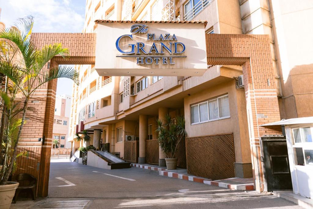 a hotel with a sign that reads grand hotel at The Grand Plaza Hotel Smouha in Alexandria