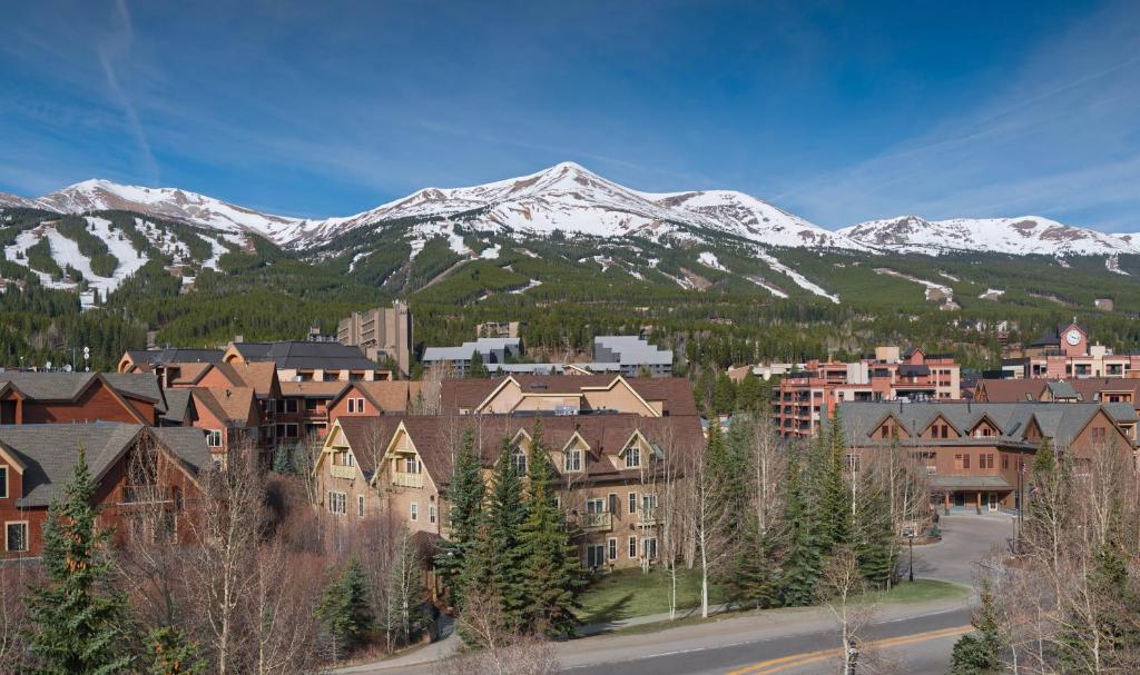 a town with snow capped mountains in the background at The Residences at Main Street Station by Hyatt Vacation Club in Breckenridge
