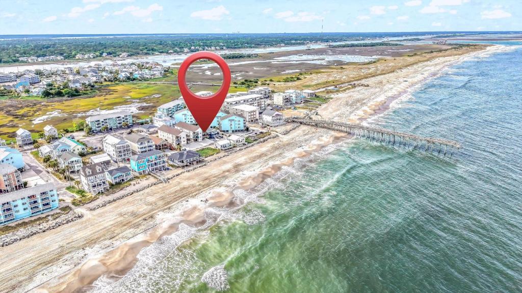 an aerial view of a beach with a red marker at 3 BDR, Oceanview's, Walk to Pier in Carolina Beach