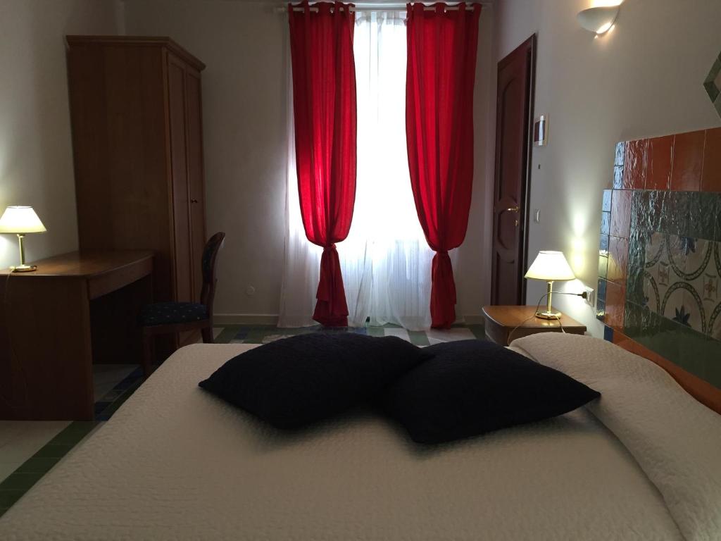 Postel nebo postele na pokoji v ubytování Via Roma 205